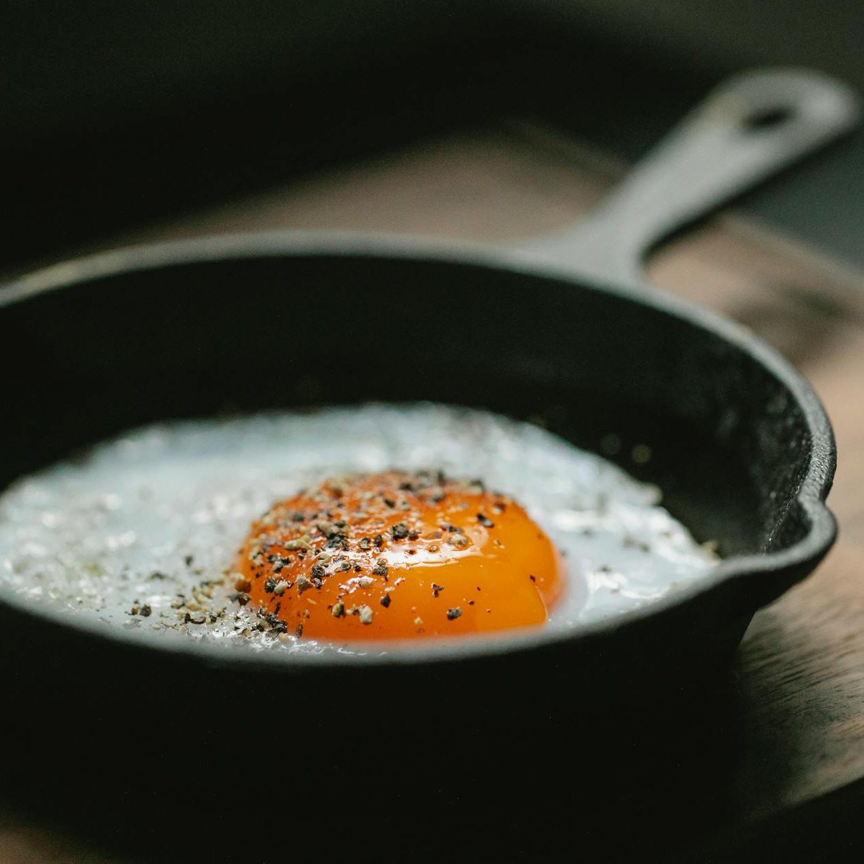 delicious breakfast with fried eggs on wooden board